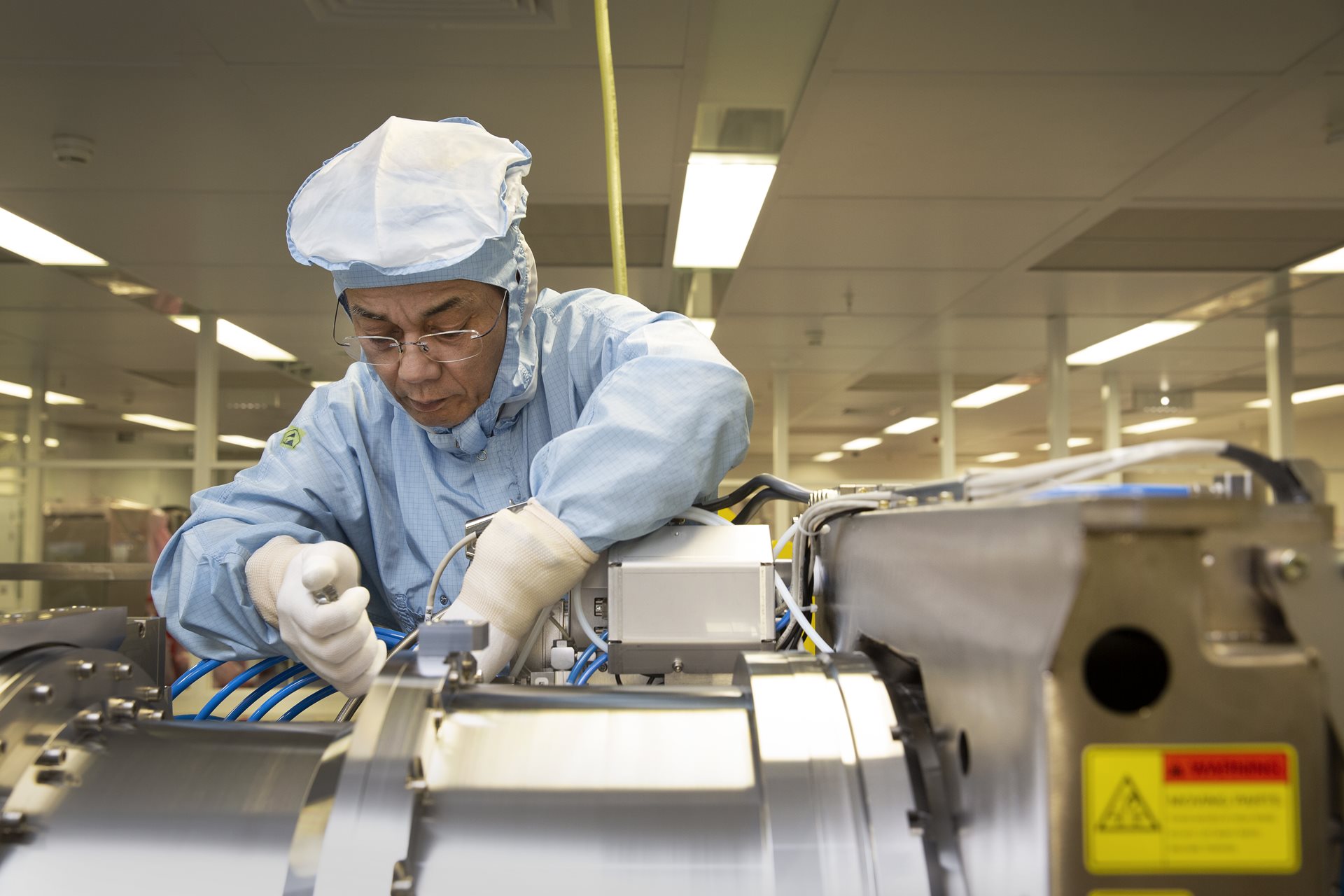 Engineer working in the clean room Engineer working in the clean room