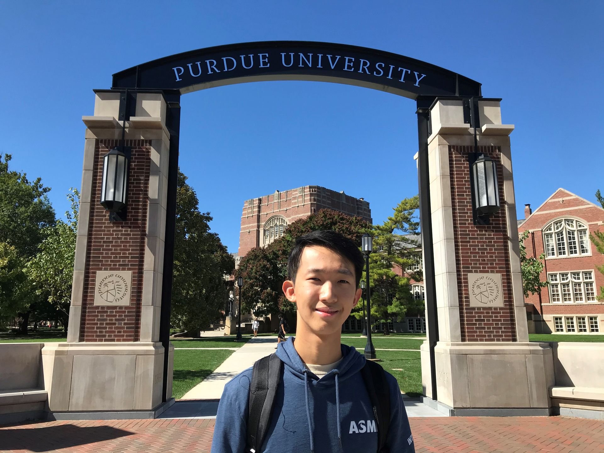 ASML intern Jason Jeon poses in front of Purdue University in Indiana.