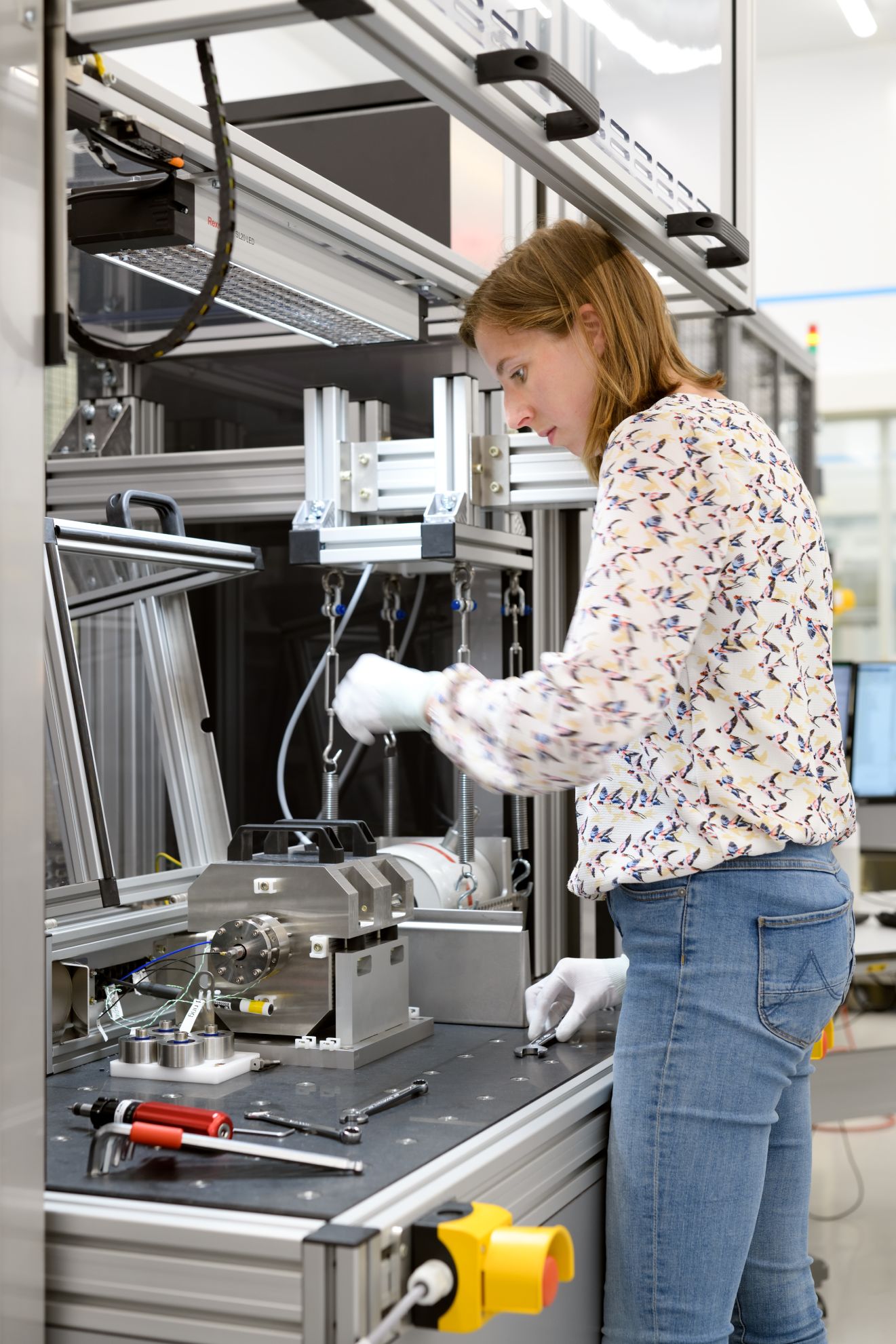 An ASML employee tests mechanics.