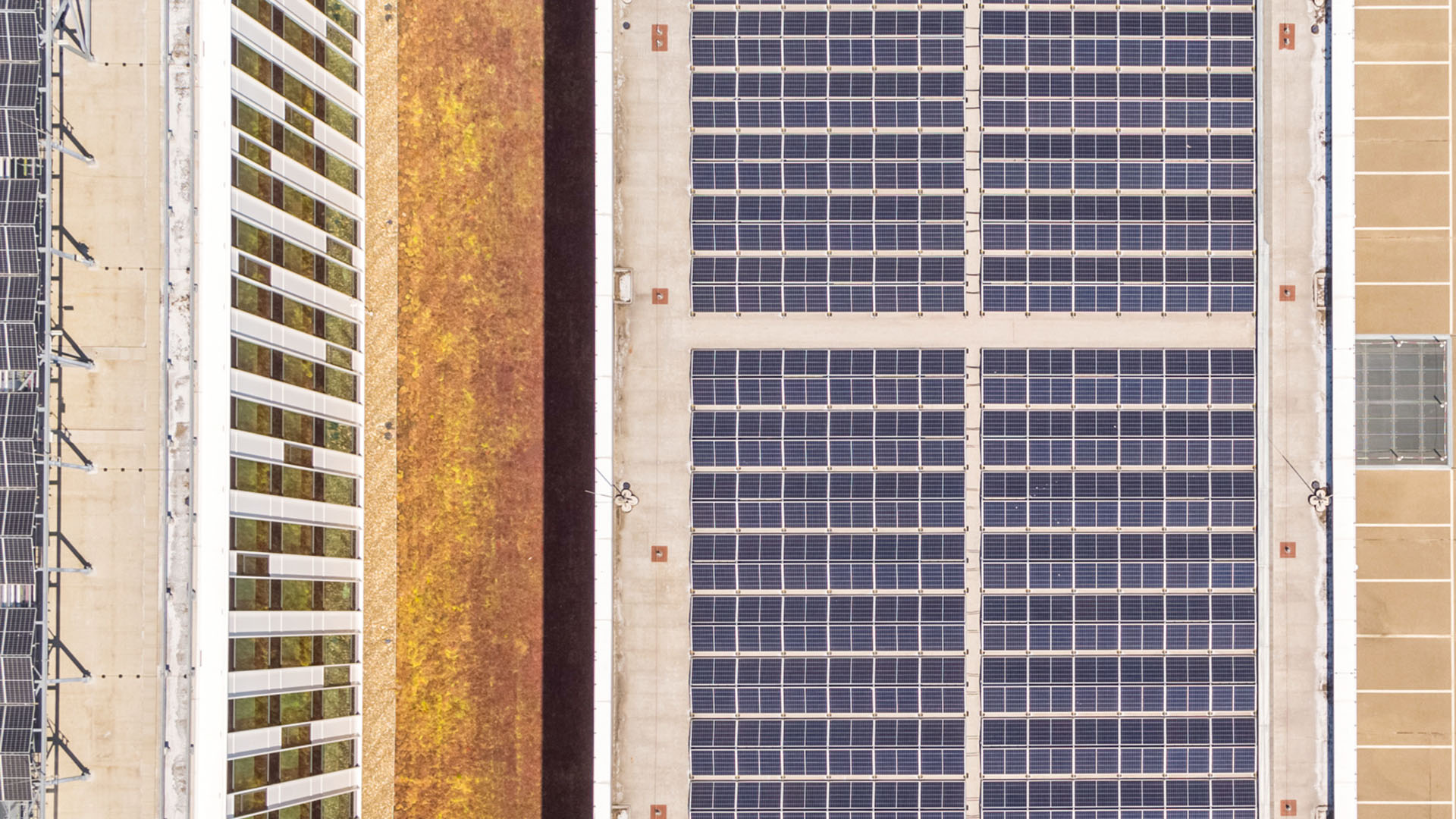 Top view of Building 5L featuring a combination of rooftop installations including solar panels. Top view of Building 5L featuring a combination of rooftop installations including solar panels.