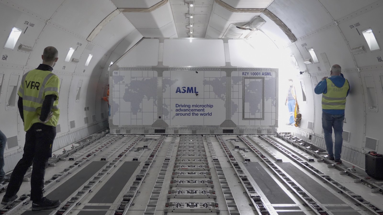 ASML container with parts of a lithography system is loaded into a cargo plane. ASML container with parts of a lithography system is loaded into a cargo plane.