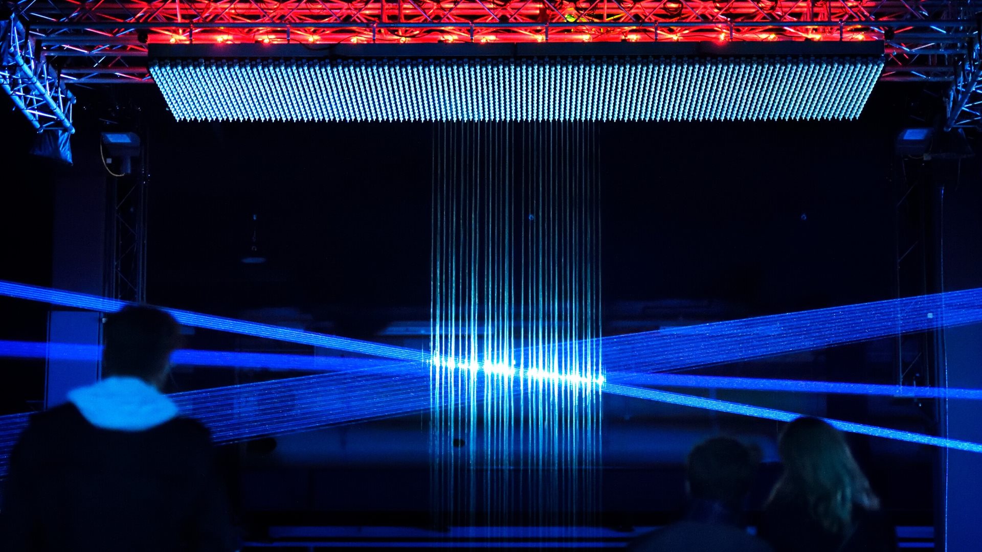 Drop of Light GLOW 2021 in action, people watch as light creates a glowing ball.