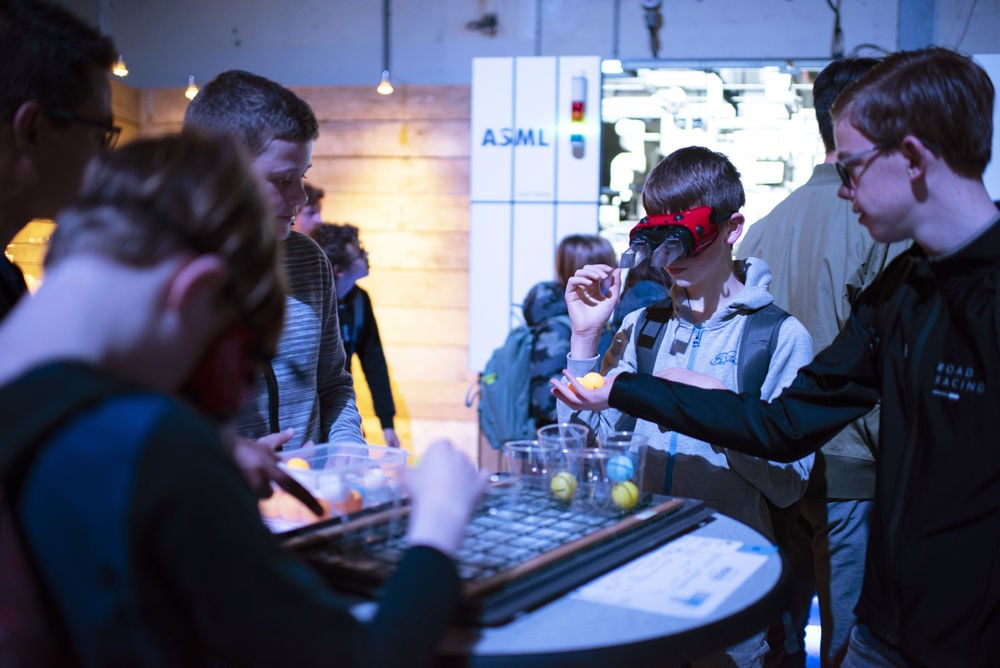 Young people wearing virtual reality googles interact with a technology exhibition at Night of the Nerds. Young people wearing virtual reality googles interact with a technology exhibition at Night of the Nerds.