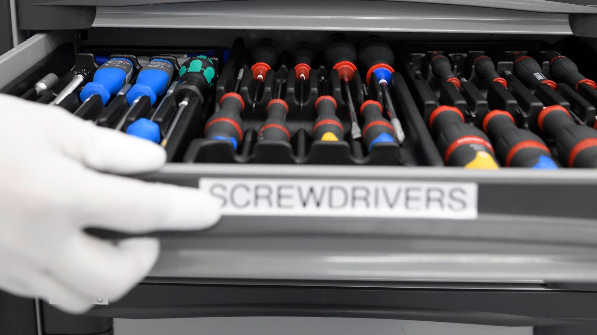 hand opening drawer of screwdrivers hand opening drawer of screwdrivers