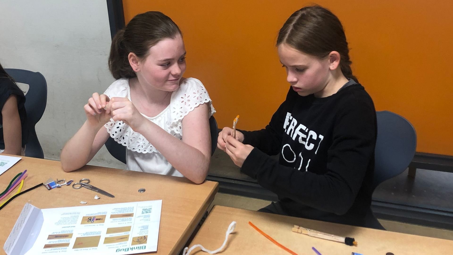 two students work together to make a BlinkBug STEM challenge