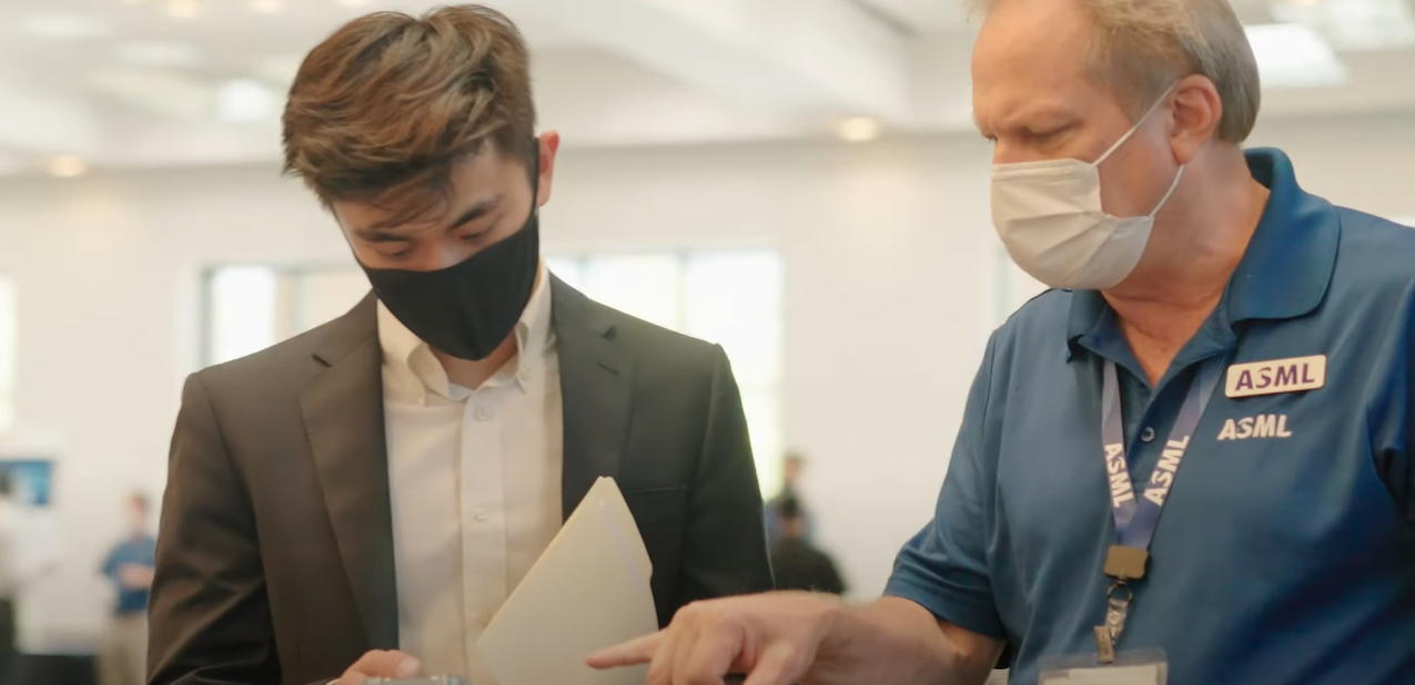 ASML employees talk in the office ASML employees talk in the office